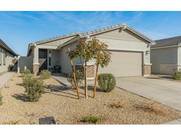 One-story home with a two-car garage and desert landscaping at 17352 W Country Club Ter, Surprise, AZ 85387