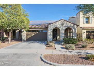 Single-story home with solar panels and landscaped front yard at 2135 N Heritage St, Buckeye, AZ 85396