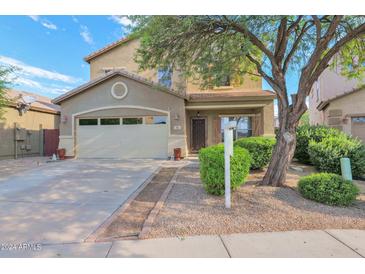 Two-story house with attached garage and landscaped front yard at 66 W Hayden Park Rd, San Tan Valley, AZ 85143