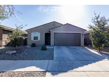 One-story house with a two-car garage and desert landscaping at 6753 W Southgate Ave, Phoenix, AZ 85043