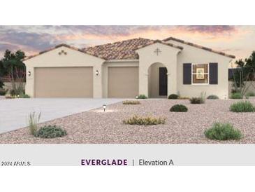 Single-story home with a 3-car garage and desert landscaping at 3624 S 177Th Ave, Goodyear, AZ 85338