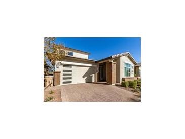 Modern home with attractive curb appeal and landscaped front yard at 5273 N 207Th Dr, Buckeye, AZ 85396