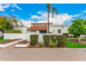 Single-story home with landscaped yard and attractive facade at 2152 E Calle Maderas --, Mesa, AZ 85213