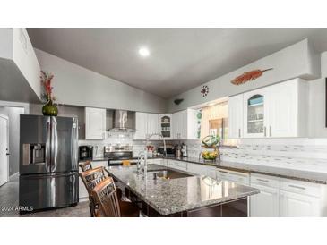 Modern kitchen features granite countertops and stainless steel appliances at 20165 W Moccasin Trl, Buckeye, AZ 85326