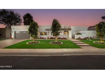 Stunning contemporary home with landscaped front yard and brick driveway at 8508 E Mustang Trl, Scottsdale, AZ 85258