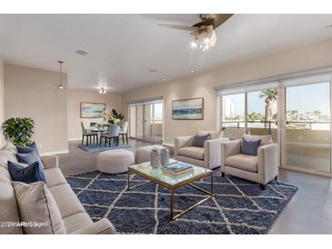 Bright living room features modern furniture and access to a balcony at 3600 N 5Th Ave # 304, Phoenix, AZ 85013