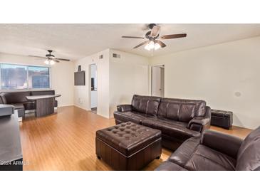 Living room features hardwood floors and a comfy seating area at 7141 N 16Th St # 230, Phoenix, AZ 85020