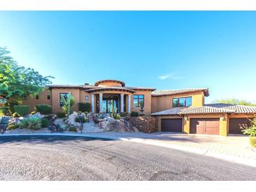 Stunning desert home with large three car garage, and mature landscaping at 10742 E Greythorn Dr, Scottsdale, AZ 85262