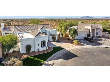 Stunning aerial view of a luxurious home with mountain views at 11549 E Bella Vista Dr, Scottsdale, AZ 85259