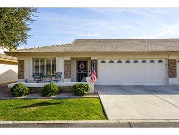 Single-story home with two-car garage and landscaped front yard at 11250 E Kilarea Ave # 252, Mesa, AZ 85209