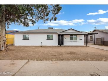 Newly renovated single story home with white brick exterior and modern landscaping at 1014 S Price Rd, Tempe, AZ 85281