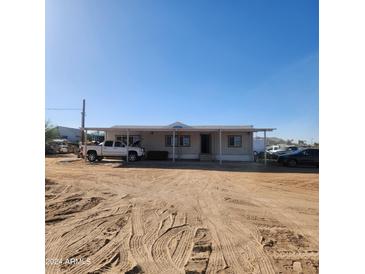 Ranch style home with covered porch and spacious yard at 30188 N Gary Rd, Queen Creek, AZ 85142