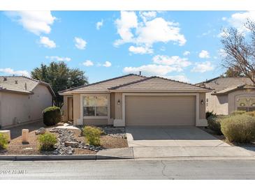 Single-story house with a two-car garage and landscaped front yard at 3371 E Torrey Pines Ln, Chandler, AZ 85249