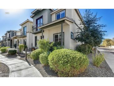 Modern two-story home with landscaped front yard and walkway at 11900 N 32Nd St # 2, Phoenix, AZ 85028