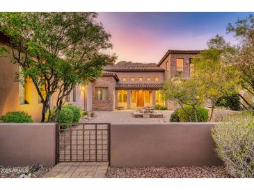 Stunning desert home with stone accents and courtyard entry at 10030 N 23Rd St, Phoenix, AZ 85028