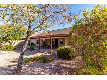 Landscaped backyard with patio and seating area at 12838 S 40Th Pl, Phoenix, AZ 85044