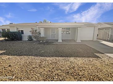 Single-story home with front yard and attached garage at 1013 W Angela Dr, Phoenix, AZ 85023