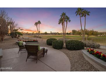 Relaxing patio with seating area, overlooking a golf course at 17164 W Calistoga Dr, Surprise, AZ 85387