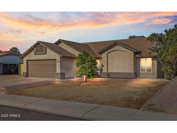 Beautiful single-story home with a two-car garage and landscaped yard at 670 W Barrow Dr, Chandler, AZ 85225