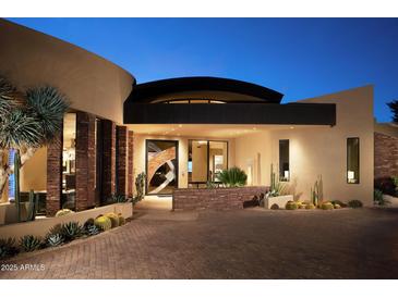 Stunning contemporary home with desert landscaping and a unique architectural design at 11271 E Cinder Cone Trl, Scottsdale, AZ 85262