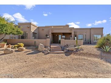 Stunning Southwestern-style home with a landscaped front yard and mountain views at 36849 N Stardust Ln, Carefree, AZ 85377