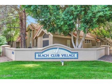 Beach Club Village entrance with landscaping and signage at 1633 E Lakeside Dr # 5, Gilbert, AZ 85234