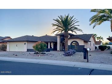 Single-story home with desert landscaping and a two-car garage at 17020 N 125Th Ave, Sun City West, AZ 85375