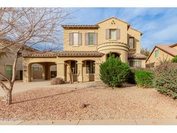 Two-story house with a covered entryway and landscaped yard at 20244 E Silver Creek Ln, Queen Creek, AZ 85142