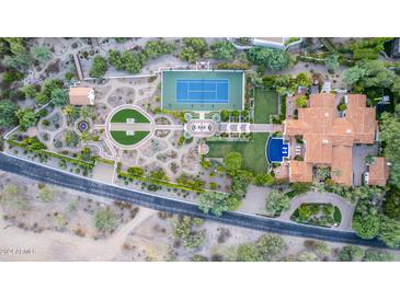 Aerial view of luxurious estate with pool, tennis court, and landscaped grounds at 6742 N 48Th St, Paradise Valley, AZ 85253