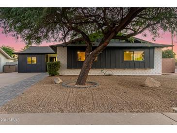 Updated mid-century modern home with a charming front yard at 8601 E Roanoke Ave, Scottsdale, AZ 85257