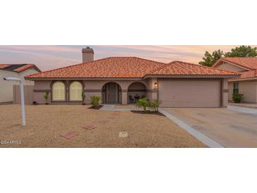 Charming single-story home with terracotta tile roof and landscaped front yard at 5630 W Kesler St, Chandler, AZ 85226