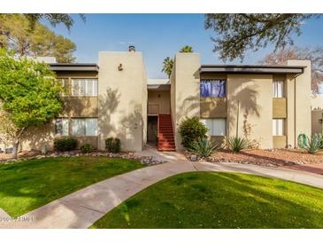 Two-story building with landscaped grounds and walkways at 4201 E Camelback Rd # 70, Phoenix, AZ 85018