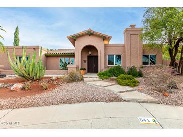 Spanish style home with attractive landscaping and stone pathway at 541 W Sweetwater Ave, Phoenix, AZ 85029