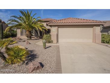 One-story home with a two-car garage and desert landscaping at 15900 W Autumn Sage Dr, Surprise, AZ 85374