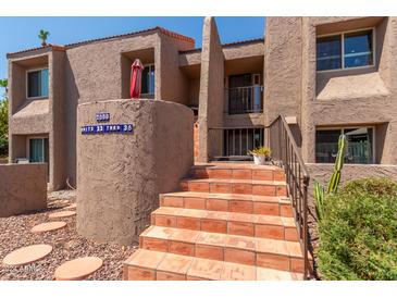 Condo building exterior with stairs and landscaping at 7000 N Via Camello Del Sur -- # 37, Scottsdale, AZ 85258