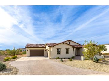 Single-story home with a terracotta tile roof and landscaped front yard at 562 N Sun Rd, Apache Junction, AZ 85119