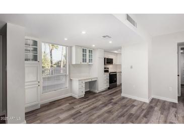 Bright kitchen features white cabinets, stainless steel appliances, and quartz countertops at 7402 E Carefree Dr # 319, Carefree, AZ 85377
