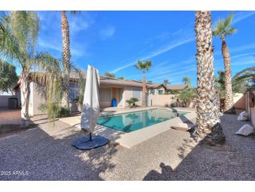 Inviting backyard pool with ample space for lounging at 3214 N Desert Horizons Ln, Casa Grande, AZ 85122