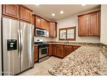 Modern kitchen with stainless steel appliances and granite countertops at 5350 E Deer Valley Dr # 1433, Phoenix, AZ 85054