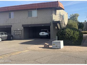 Exterior view of a two-story building with parking and landscaping at 1219 N 47Th Pl, Phoenix, AZ 85008