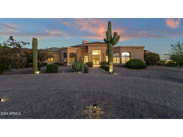 Desert landscape with a large, inviting home; showcasing the front entrance at 9325 E Paraiso Dr, Scottsdale, AZ 85255