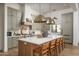 Modern kitchen with light green cabinets and large island at 3089 S Prospector Cir, Gold Canyon, AZ 85118