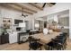 Bright dining area with a large wooden table, stylish chairs, and an open kitchen at 3119 S Prospector Cir, Gold Canyon, AZ 85118