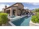 Luxury home with a spacious pool, spa, and covered patio area at 3119 S Prospector Cir, Gold Canyon, AZ 85118