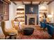 Relaxing library with a fireplace and comfortable seating at 3119 S Prospector Cir, Gold Canyon, AZ 85118