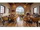 Elegant dining room with a fireplace and mountain views at 3119 S Prospector Cir, Gold Canyon, AZ 85118