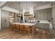 Gourmet kitchen boasts custom cabinetry, a large island with seating, and high-end finishes at 3119 S Prospector Cir, Gold Canyon, AZ 85118