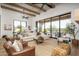 Spacious living room with hardwood floors, fireplace, and large sliding glass doors leading to backyard at 3119 S Prospector Cir, Gold Canyon, AZ 85118