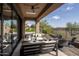 Relaxing covered patio with seating area, fire pit, and views of the surrounding landscape at 3149 S Prospector Cir, Gold Canyon, AZ 85118