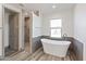 Spa-like bathroom with a freestanding soaking tub and walk-in shower at 0 N Bell Rd # 4, Queen Creek, AZ 85144
